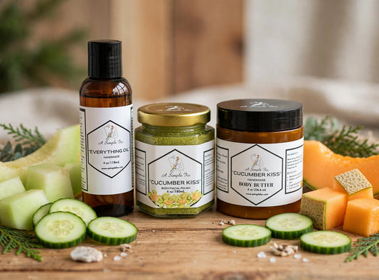 Cucumber Kiss Bundle: everything oil, body polish and body butter on warm wood with cucumber and melon